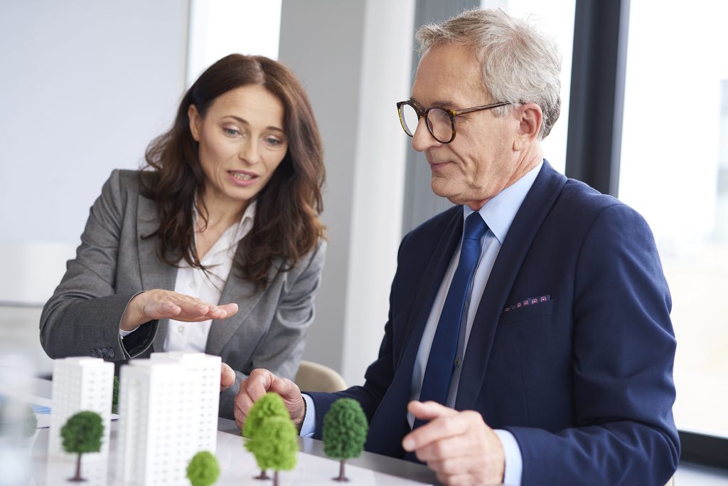Business team reviewing an architectural model