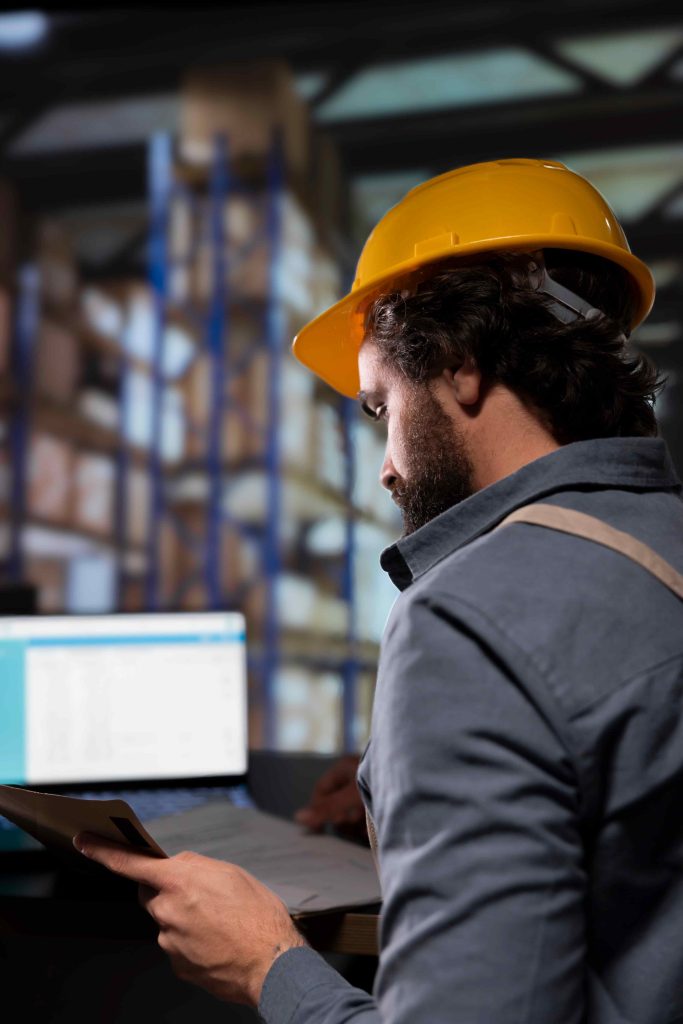 Manager reviewing supply chain contracts